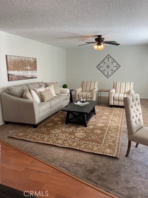 a living room with couches and painting on the wall