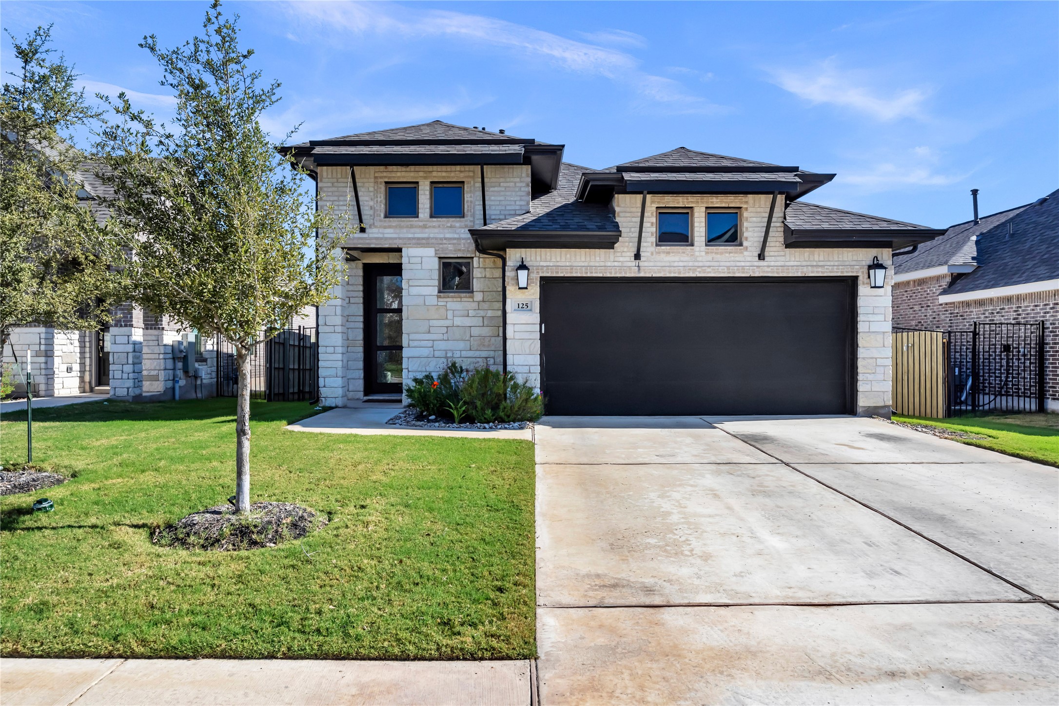 a front view of a house with a yard