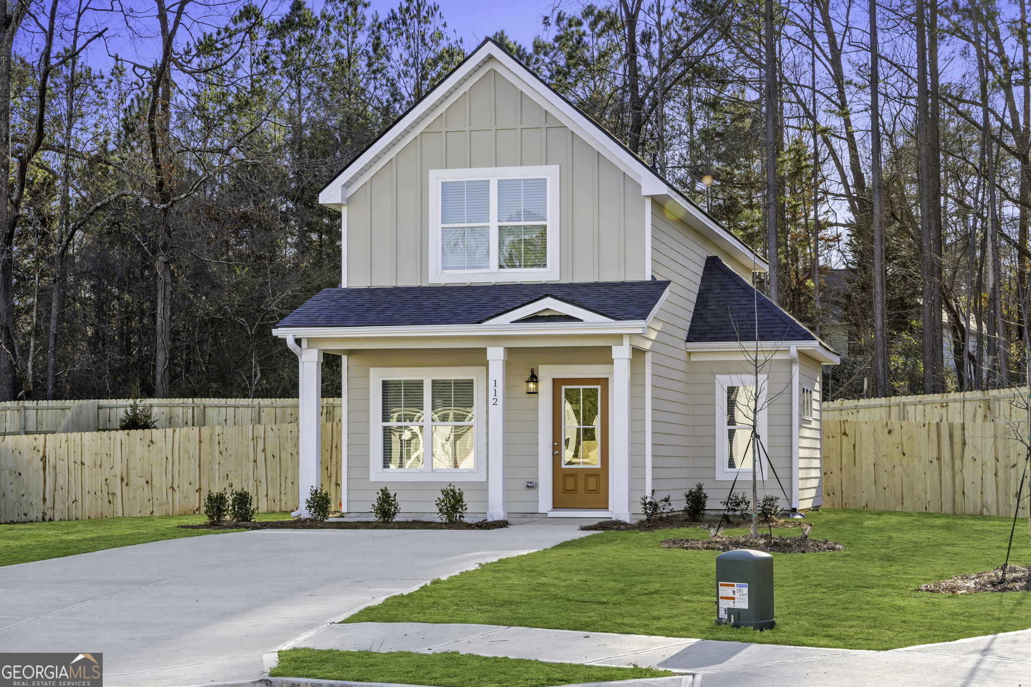 a view of a yard in front view of a house