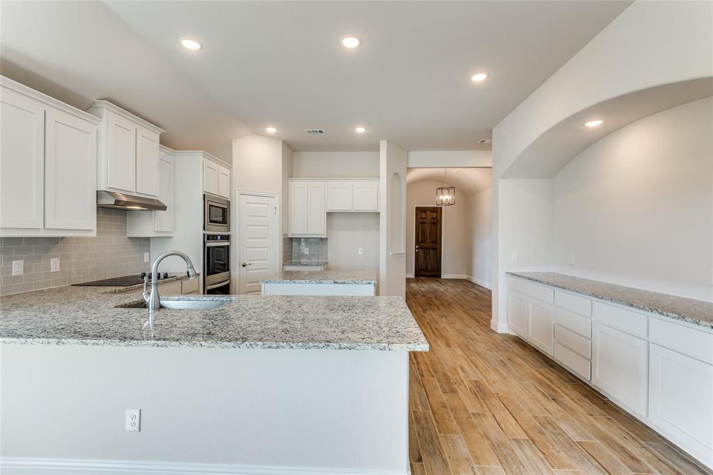 a view of living room with granite countertop furniture and fireplace