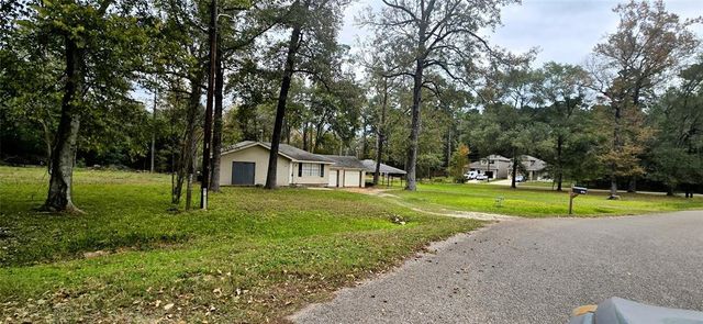 $1,400 | 707 Smokey River Bend | Lake Conroe Forest