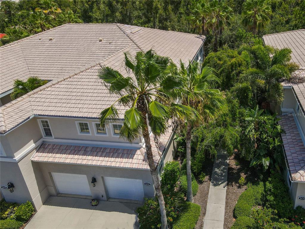 a aerial view of a house with a yard