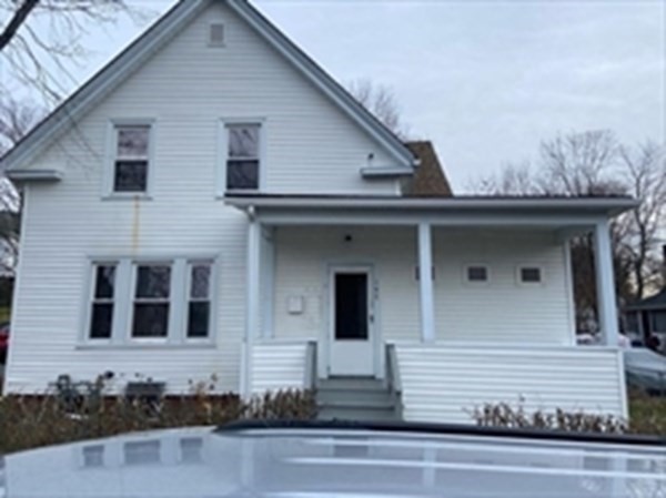 a view of a house with white walls