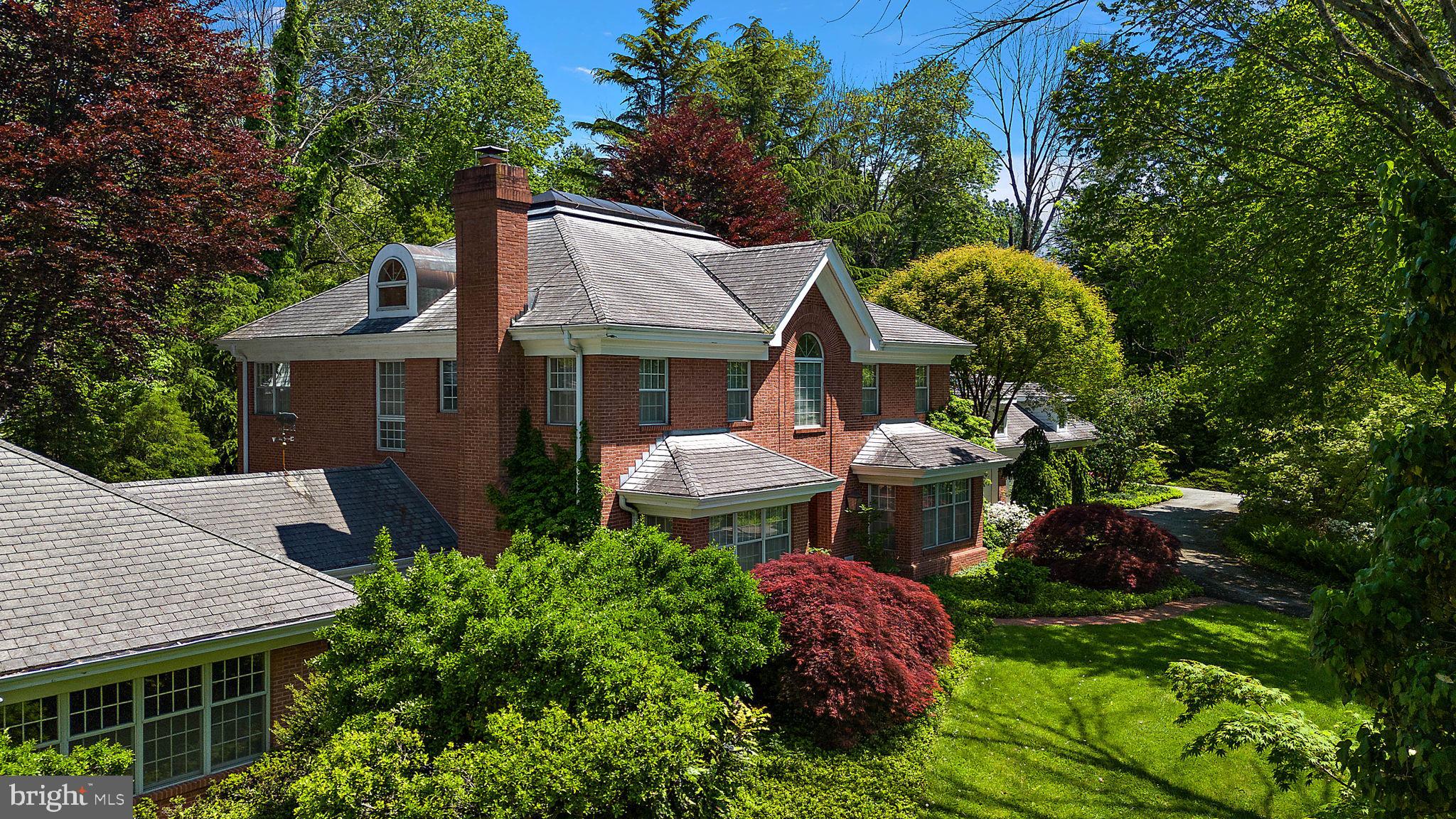 a front view of a house with a yard and a garage