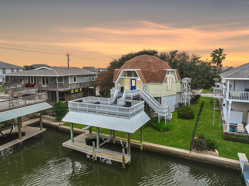 Tucked away in coveted Spanish Grant Bayside, presenting your opportunity to own one of the most unique canal-front homes on Galveston's West End!