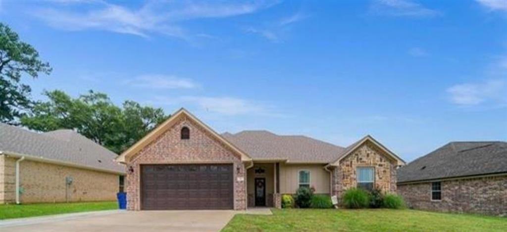 a front view of a house with yard