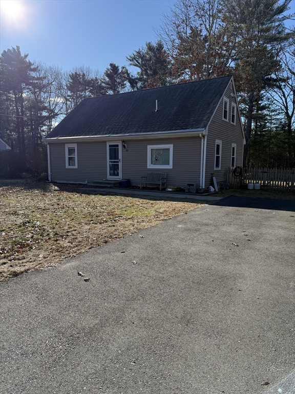 a front view of a house with yard