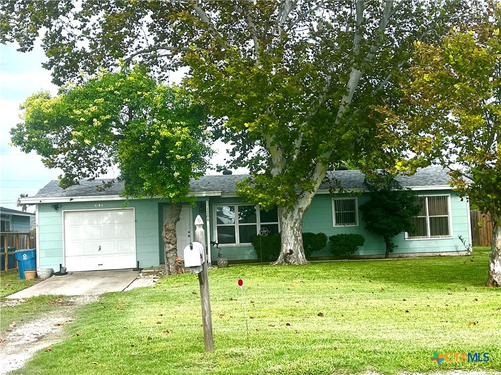 a view of a house with a yard