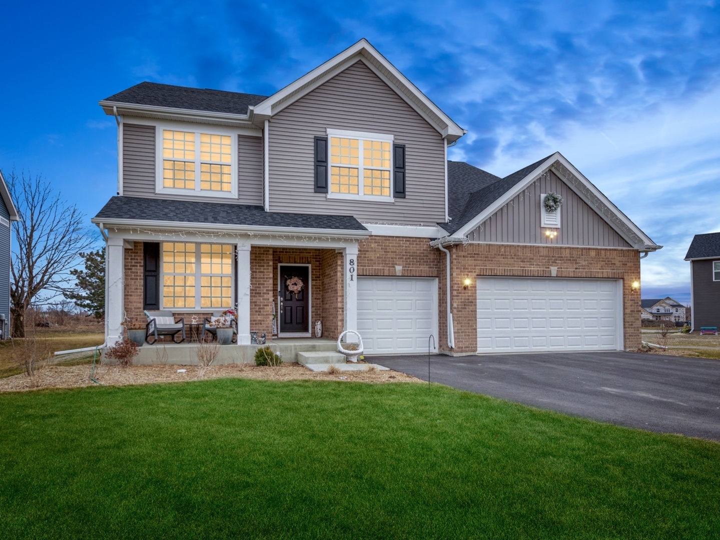 a front view of house with yard and outdoor seating