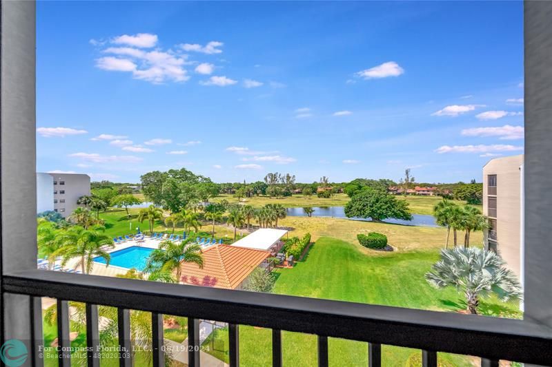 a view of swimming pool from a balcony