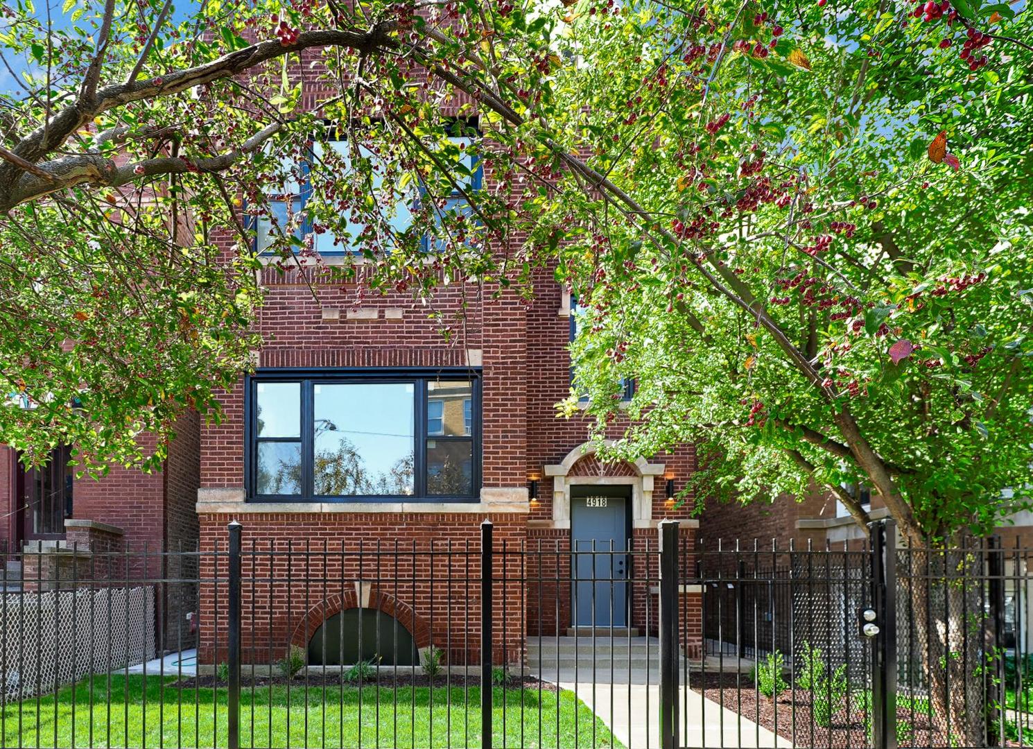 a view of house with a tree in front of it