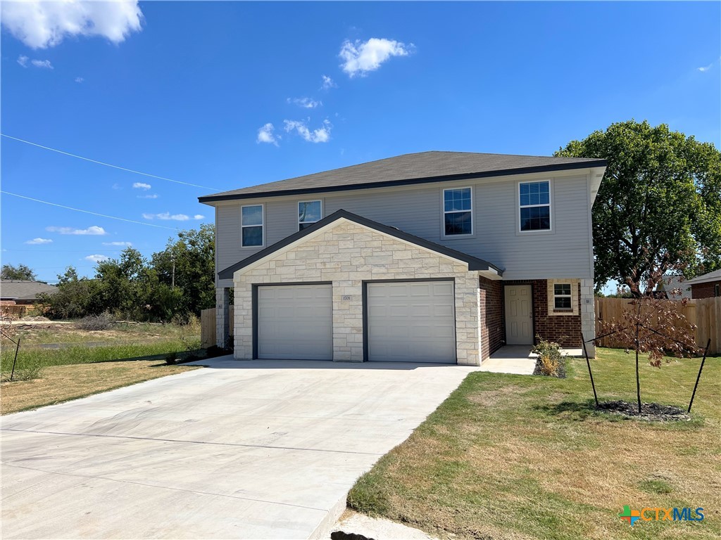 a house with yard in front of it