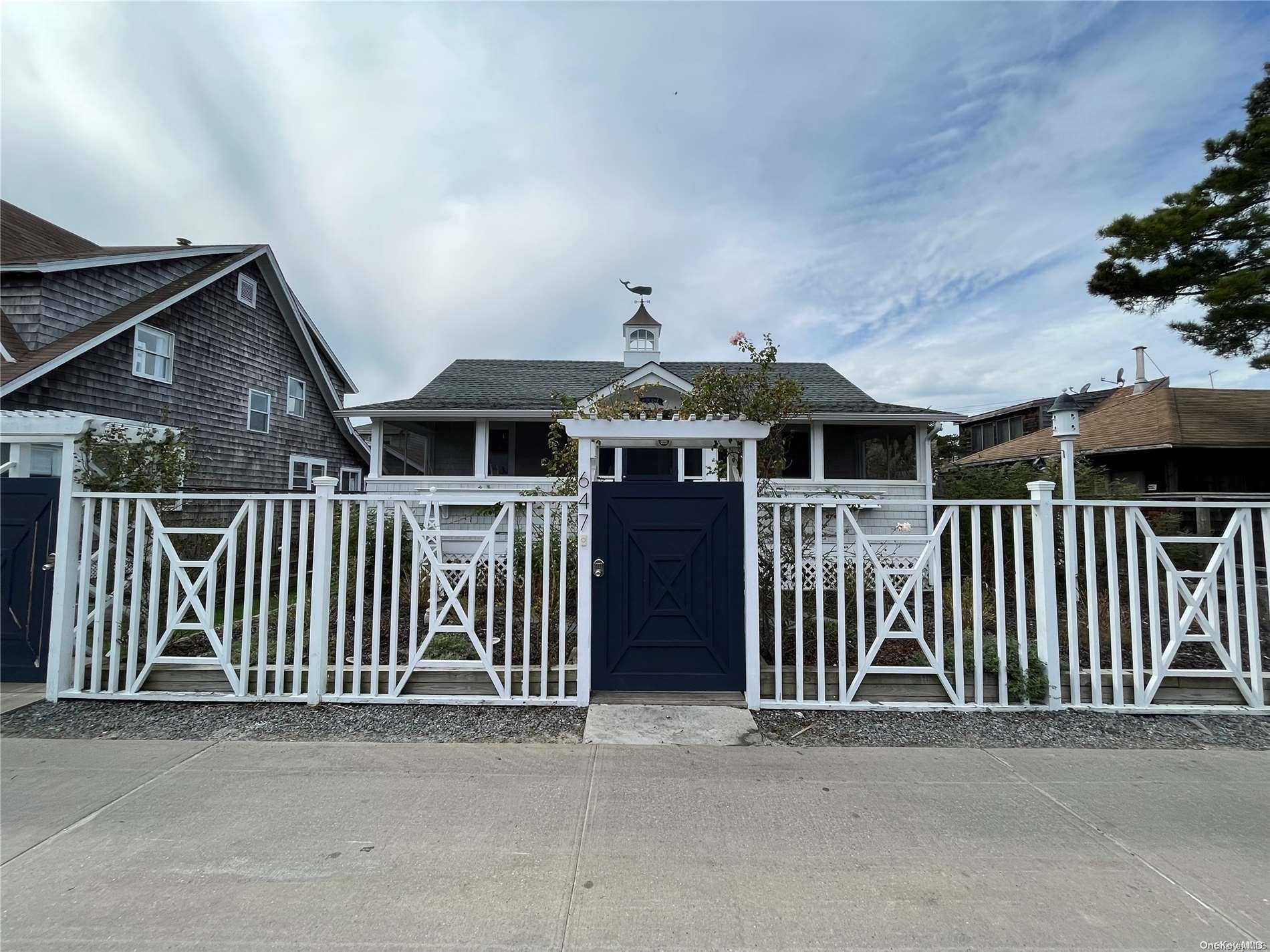 a front view of a house with parking space