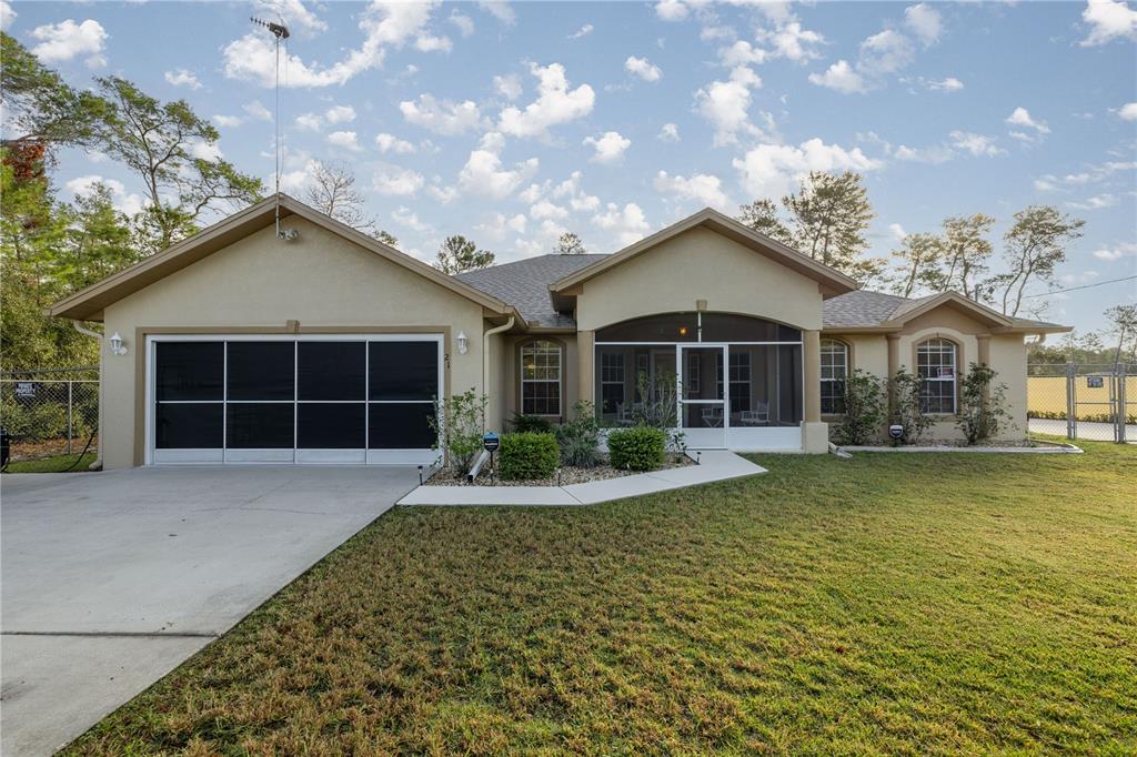 a front view of a house with a yard and porch