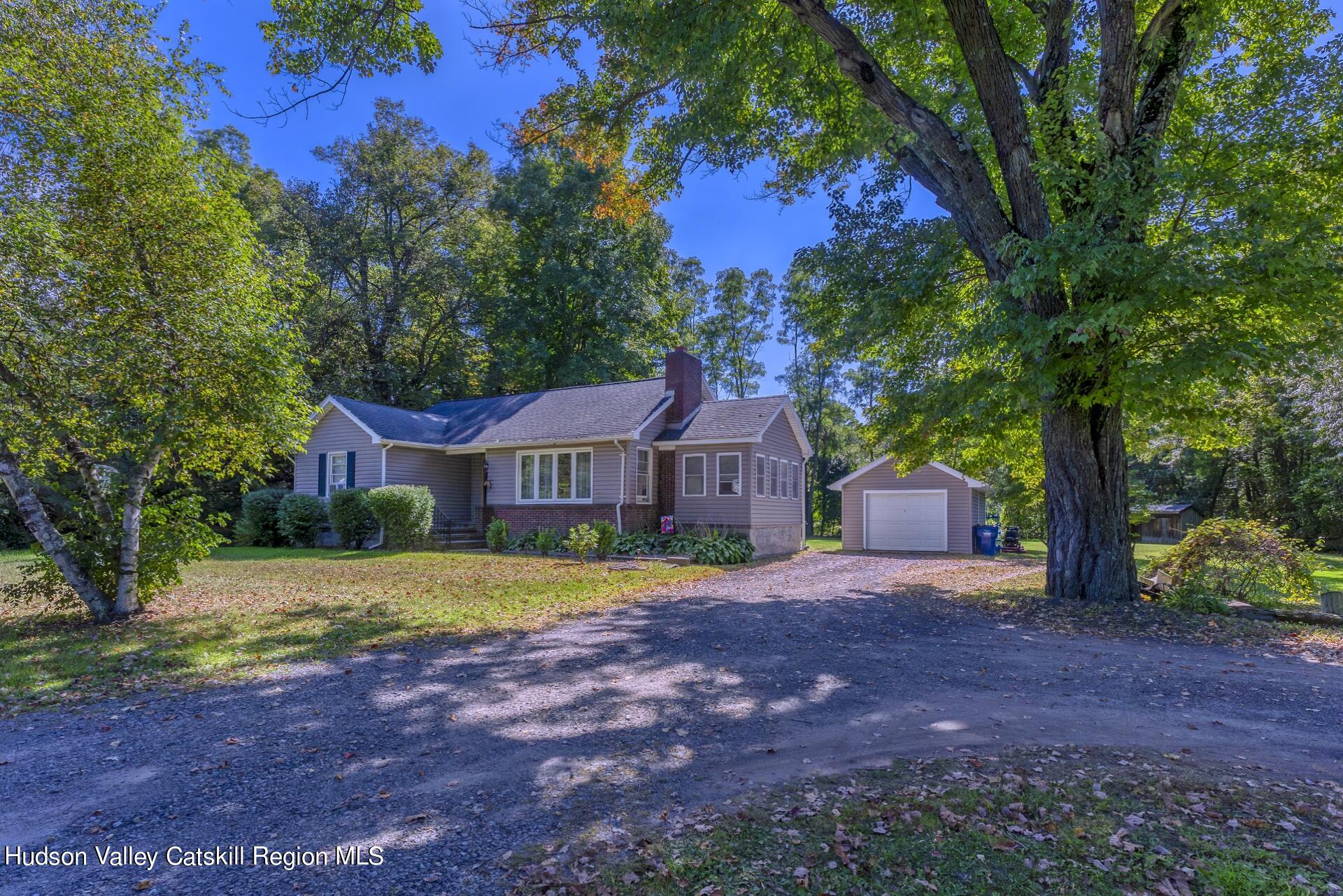 a view of a house with a yard