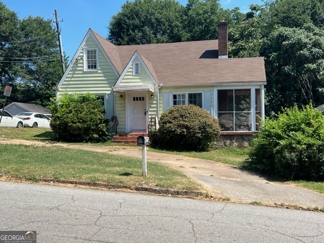 a view of a house with a yard and plants