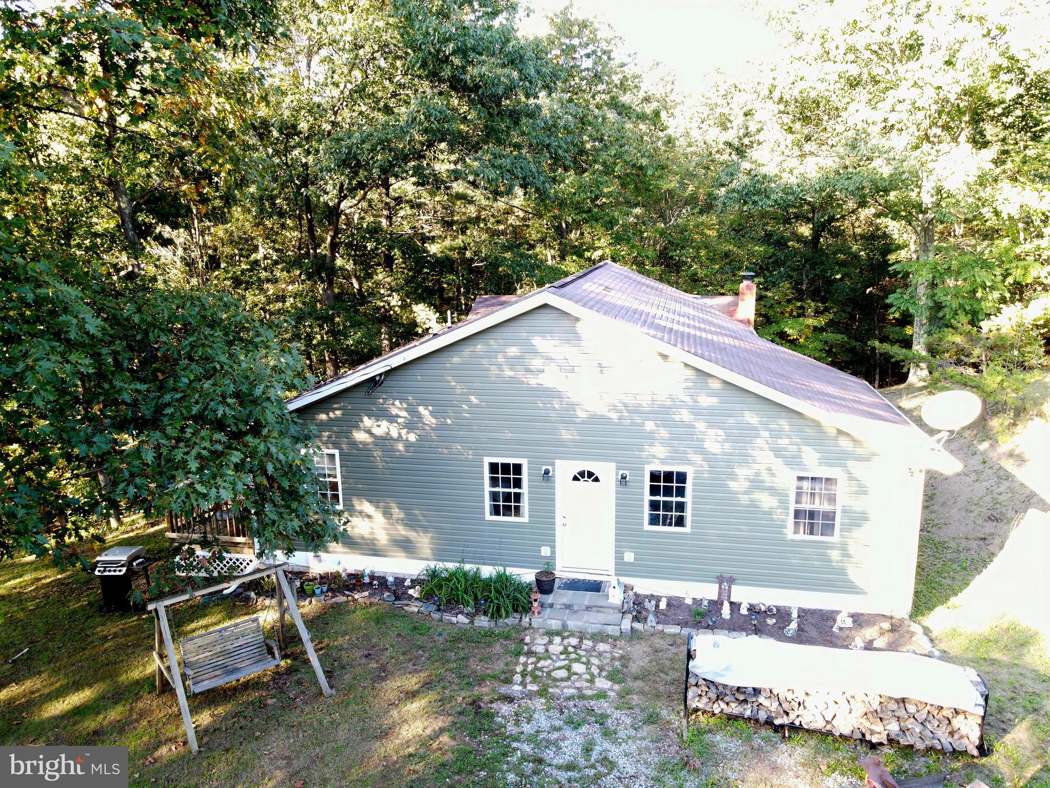 a view of backyard with a patio