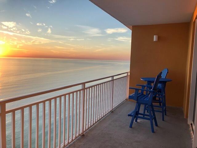 a view of a balcony with chair and table