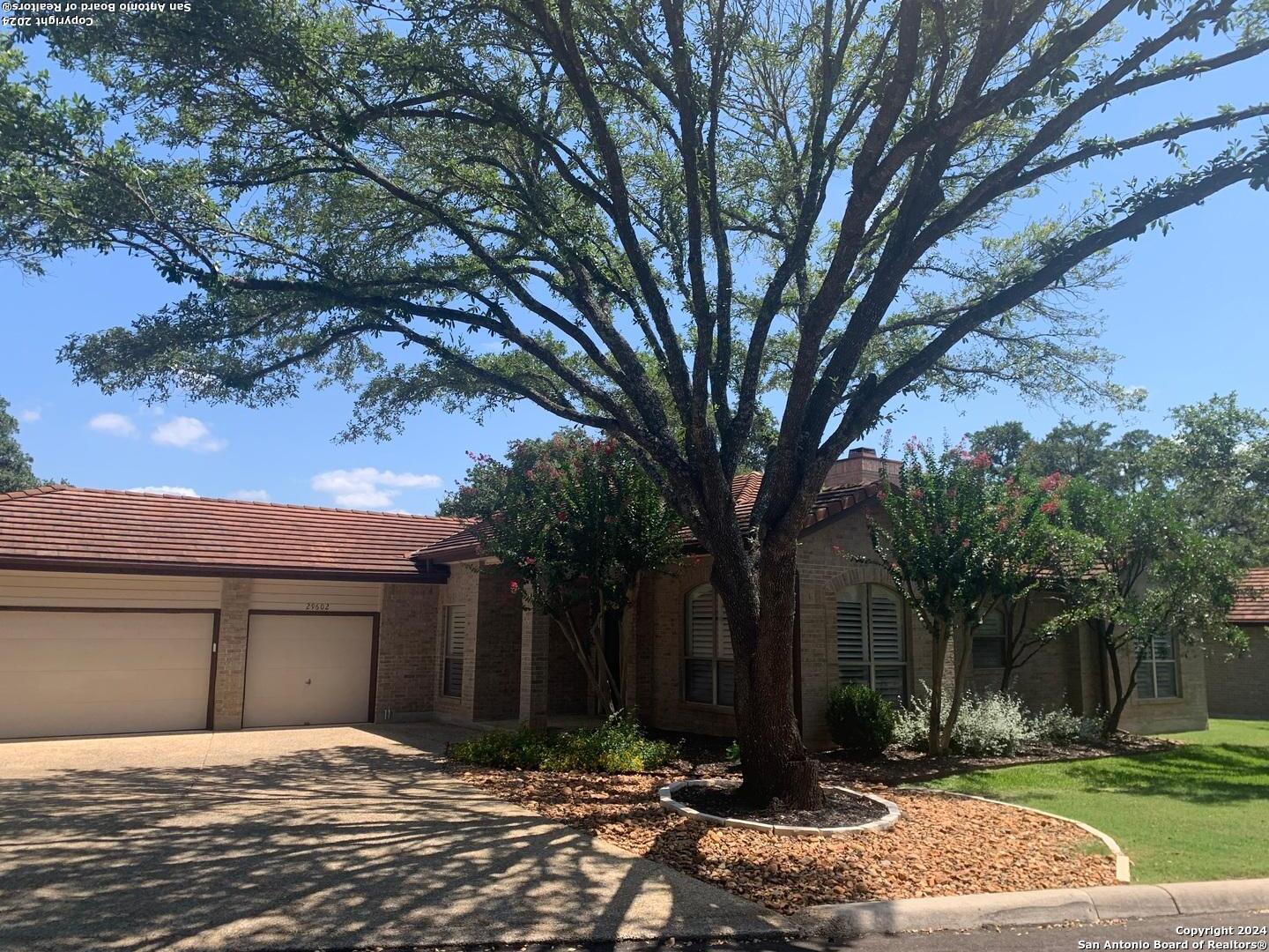 a house with trees in front of it