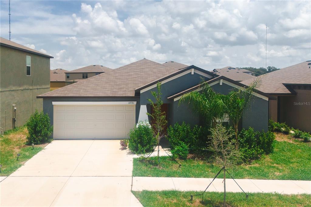 a aerial view of a house with a yard