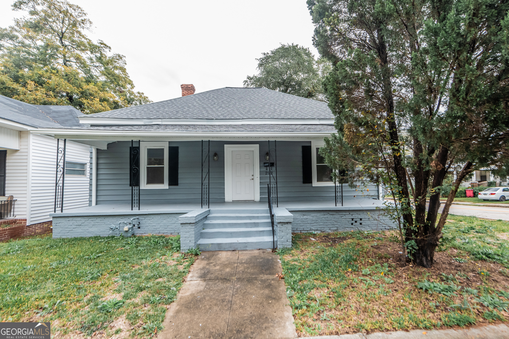 a front view of a house with garden