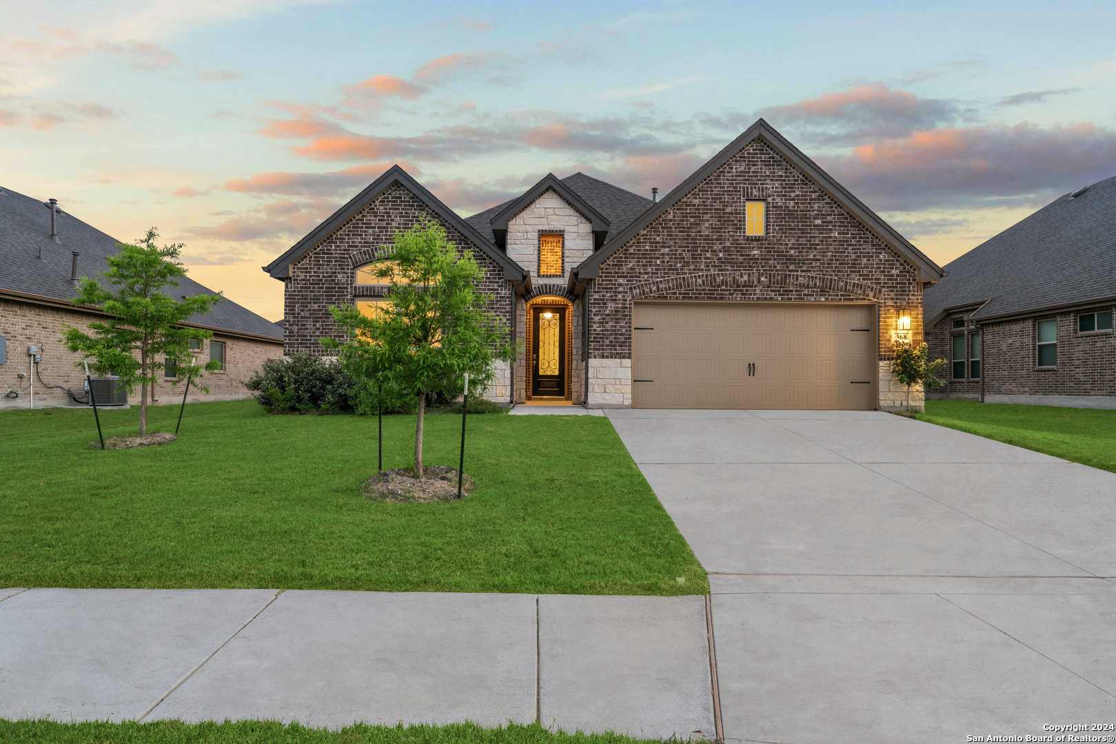 a front view of a house with a yard