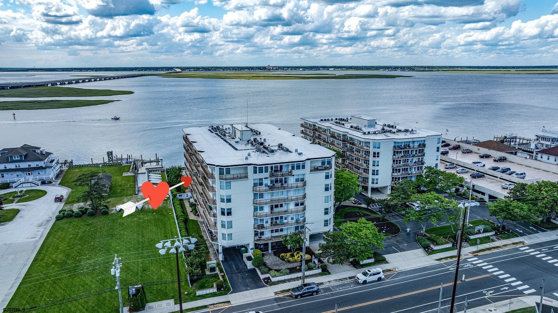 a view of a lake with a building in the background