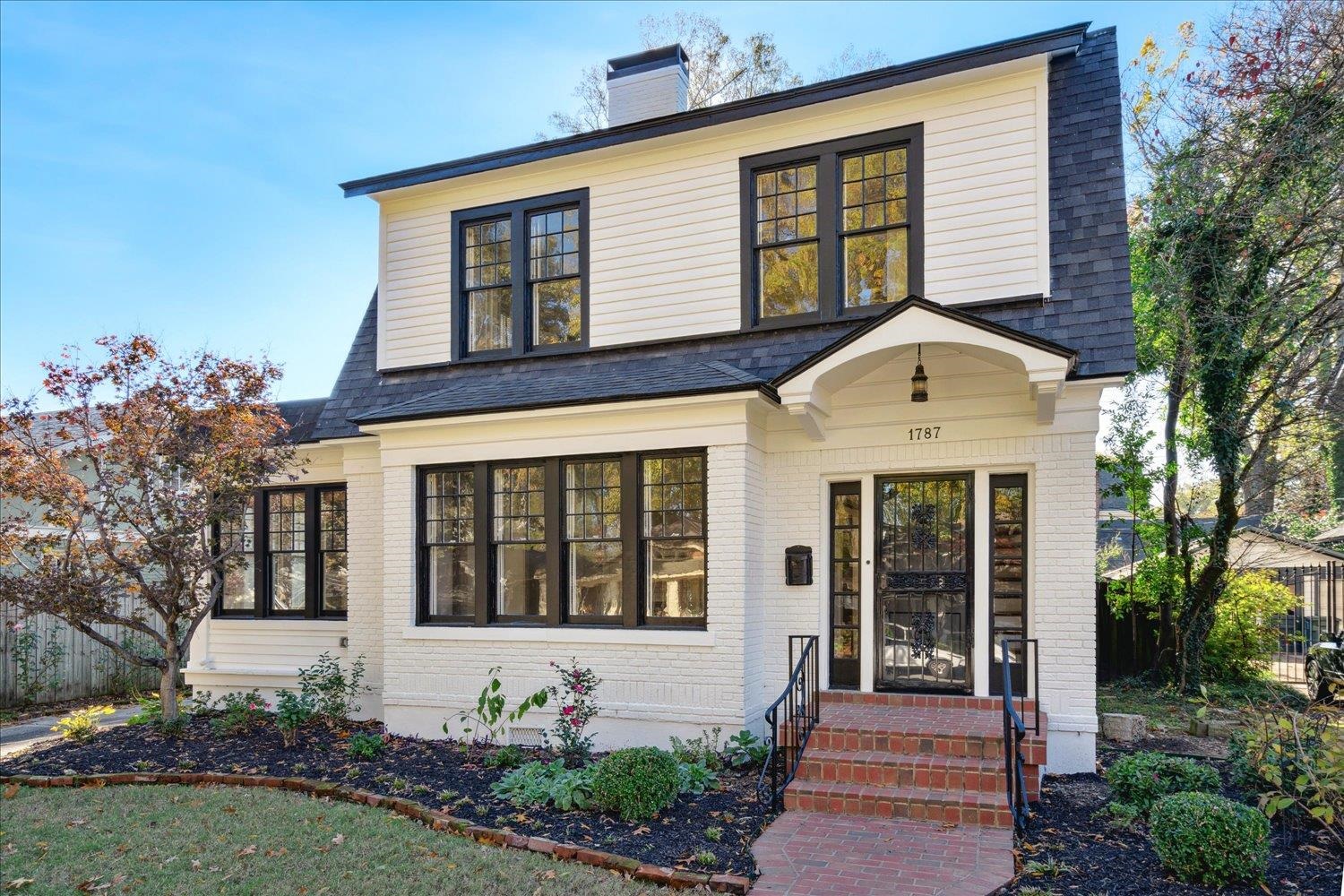 a front view of a house with garden