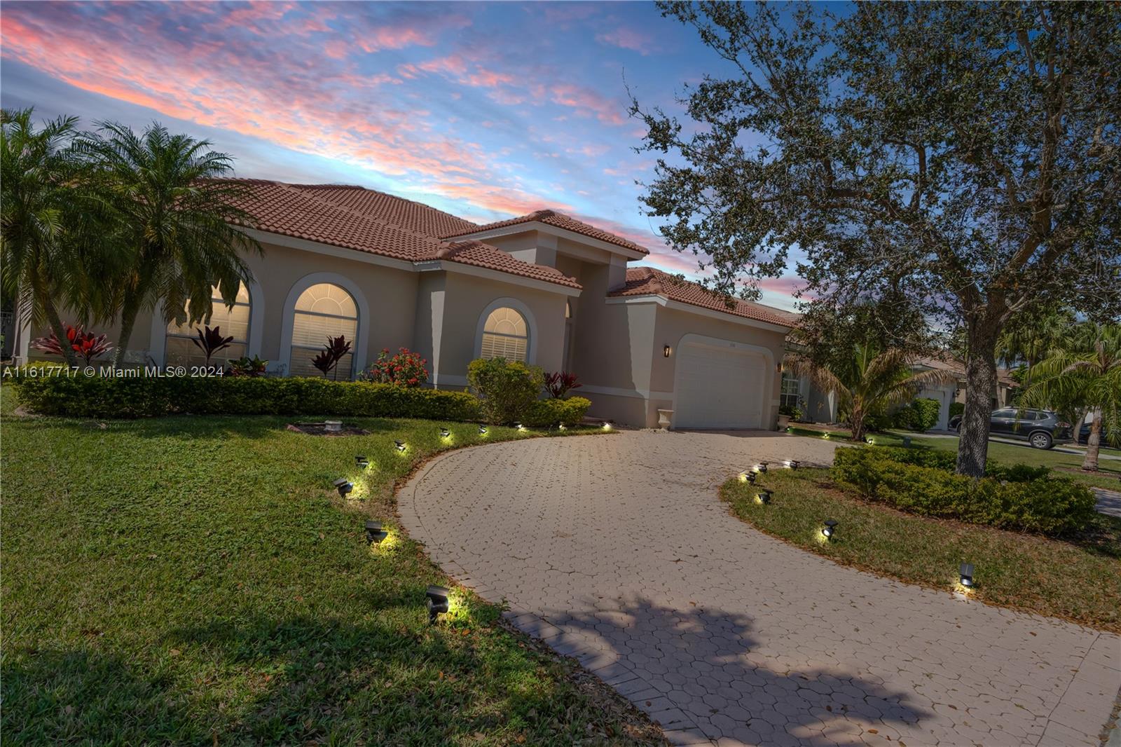 a front view of house with yard and green space