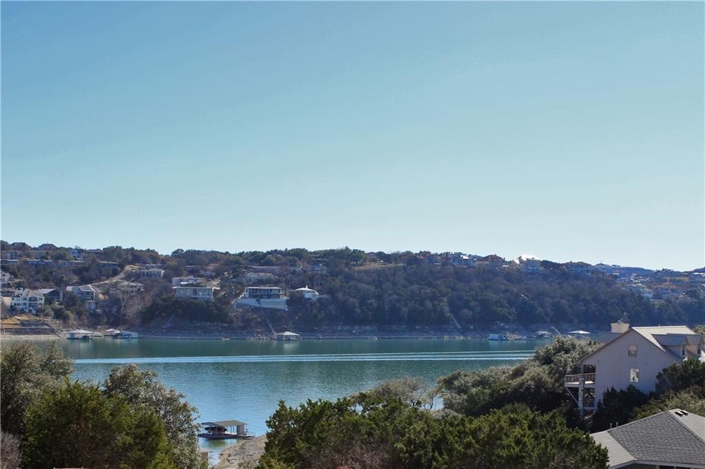 an aerial view of residential house and lake