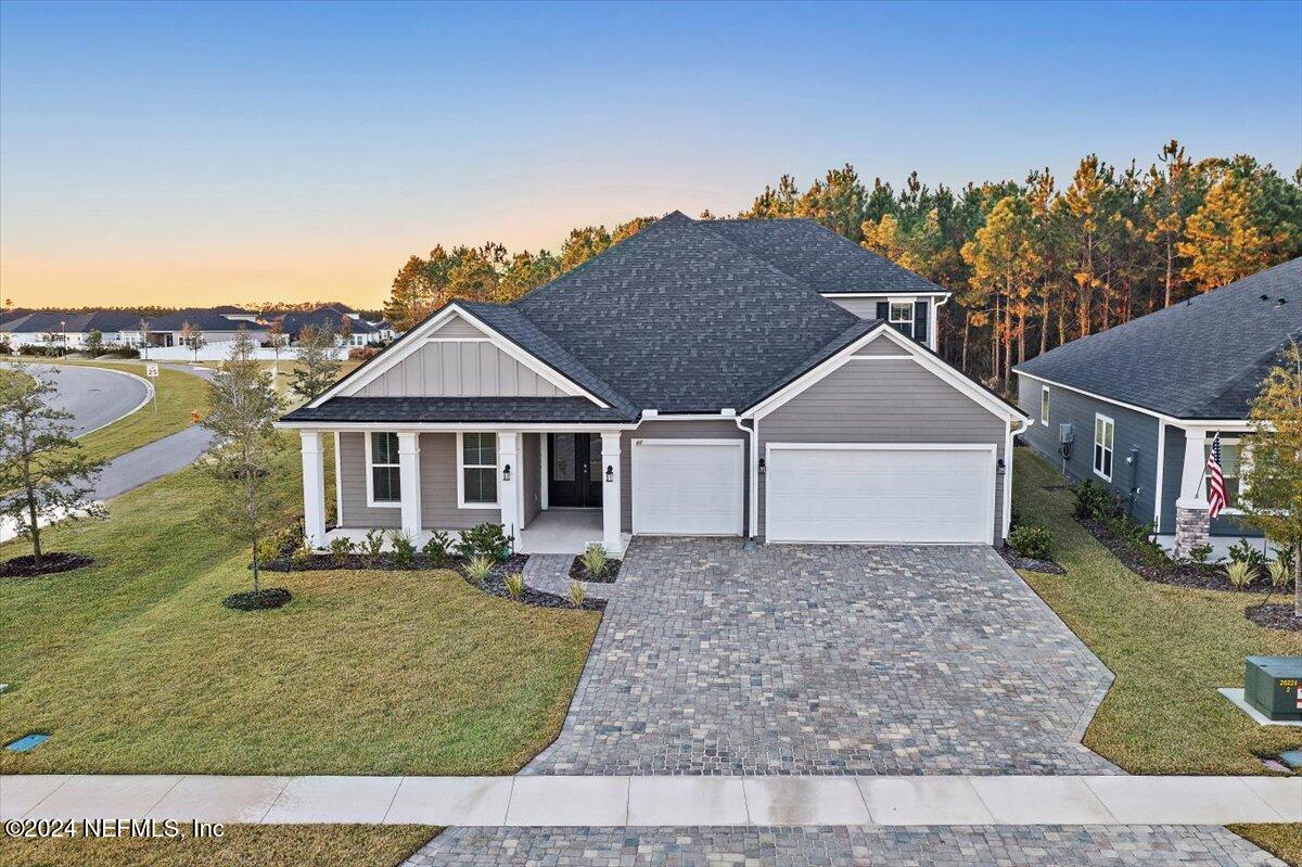 a front view of a house with a yard