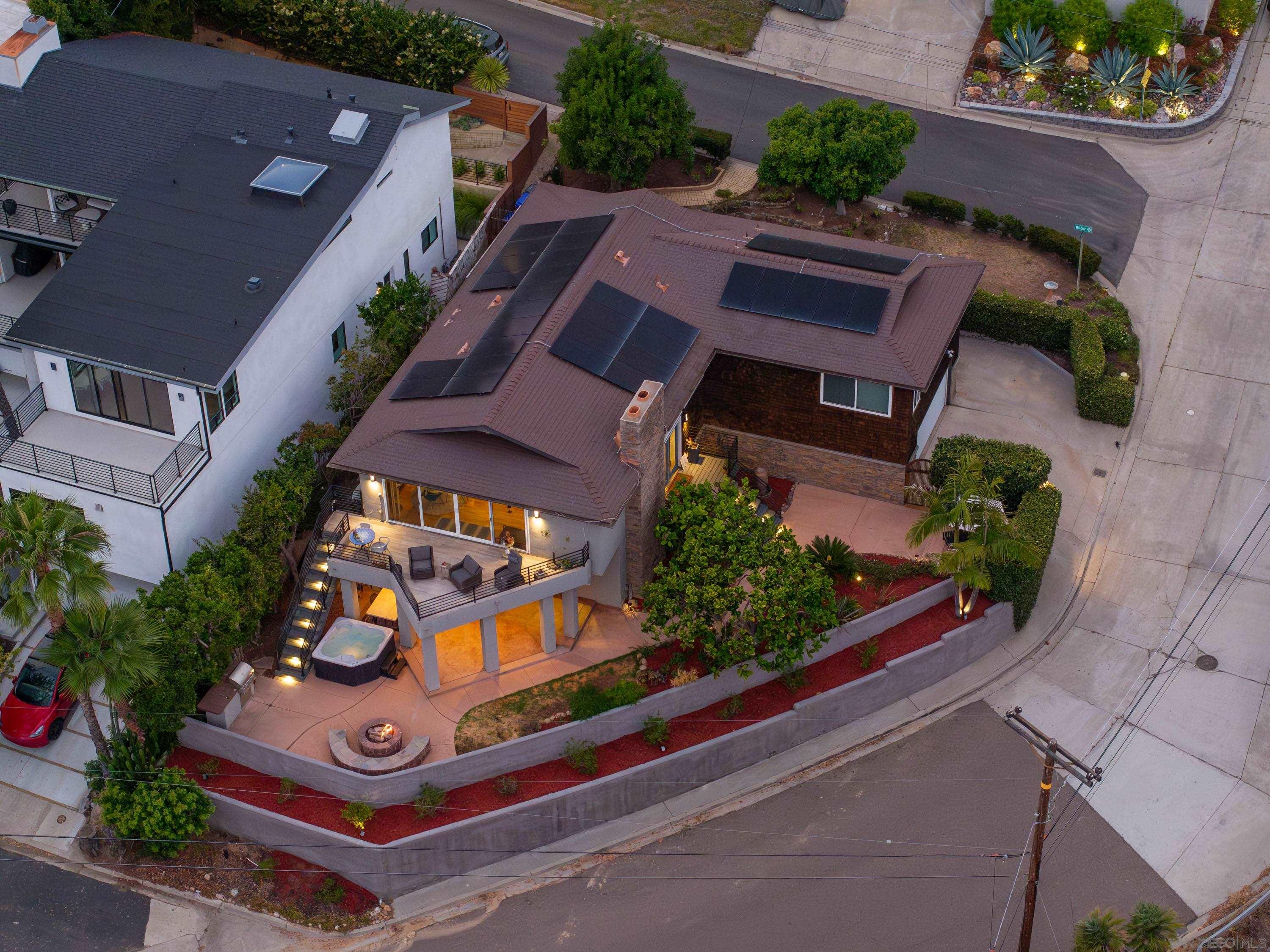 an aerial view of a house with a garden