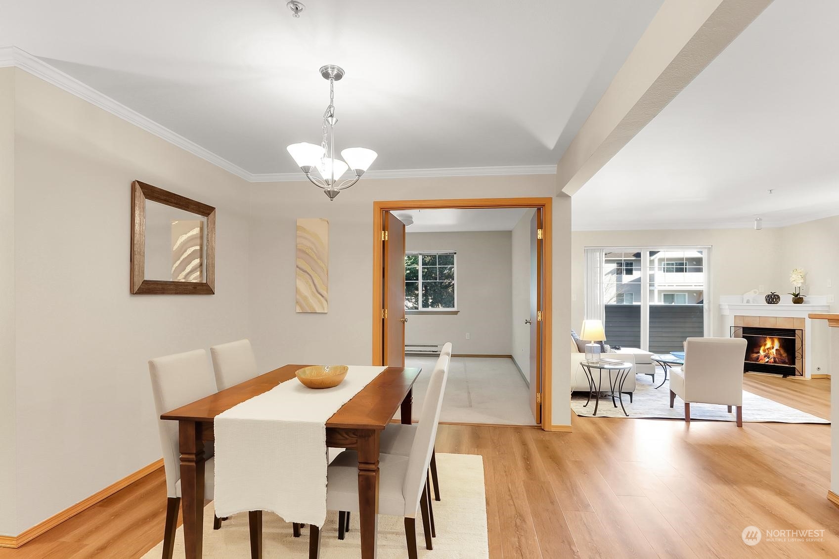 a view of a dining room with furniture and wooden floor