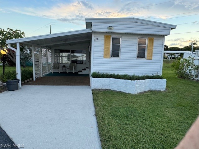 a view of a house with a porch and furniture