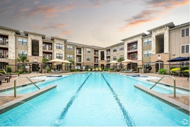 a view of a swimming pool with a lounge chairs