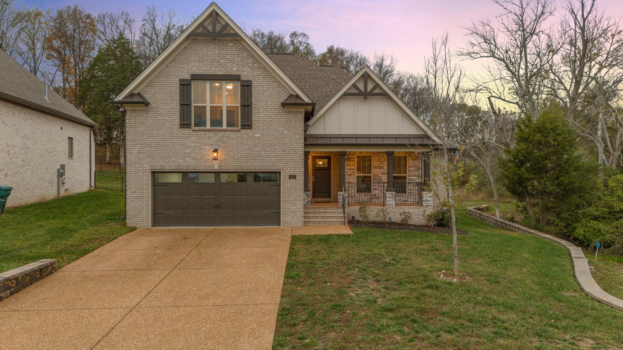 a front view of a house with a yard