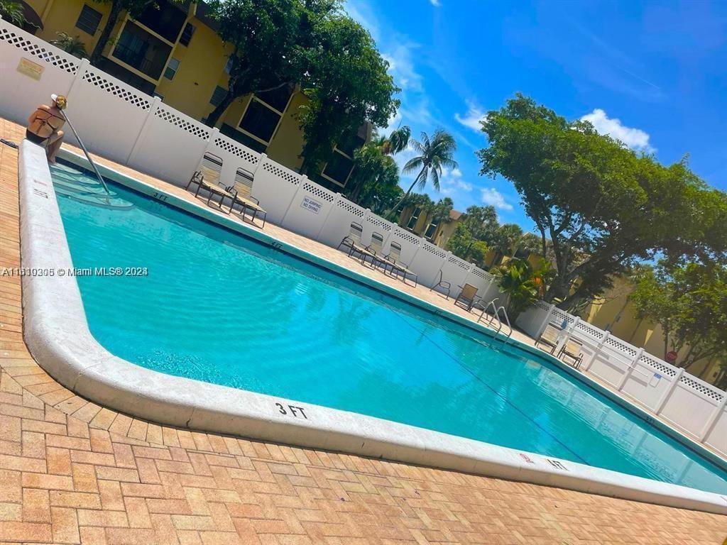 a view of swimming pool from a balcony