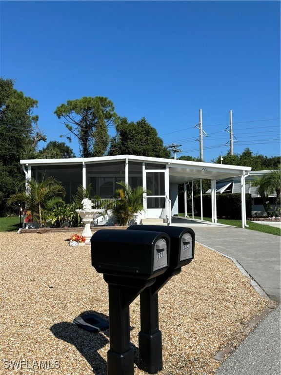 a view of house with swimming pool and outdoor seating