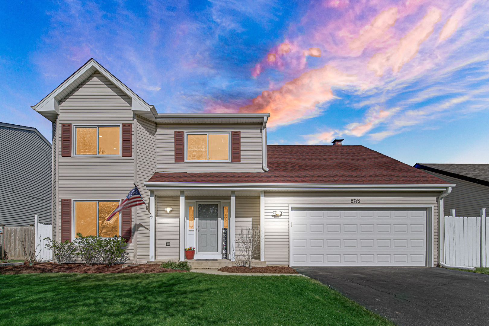 front view of a house with a yard