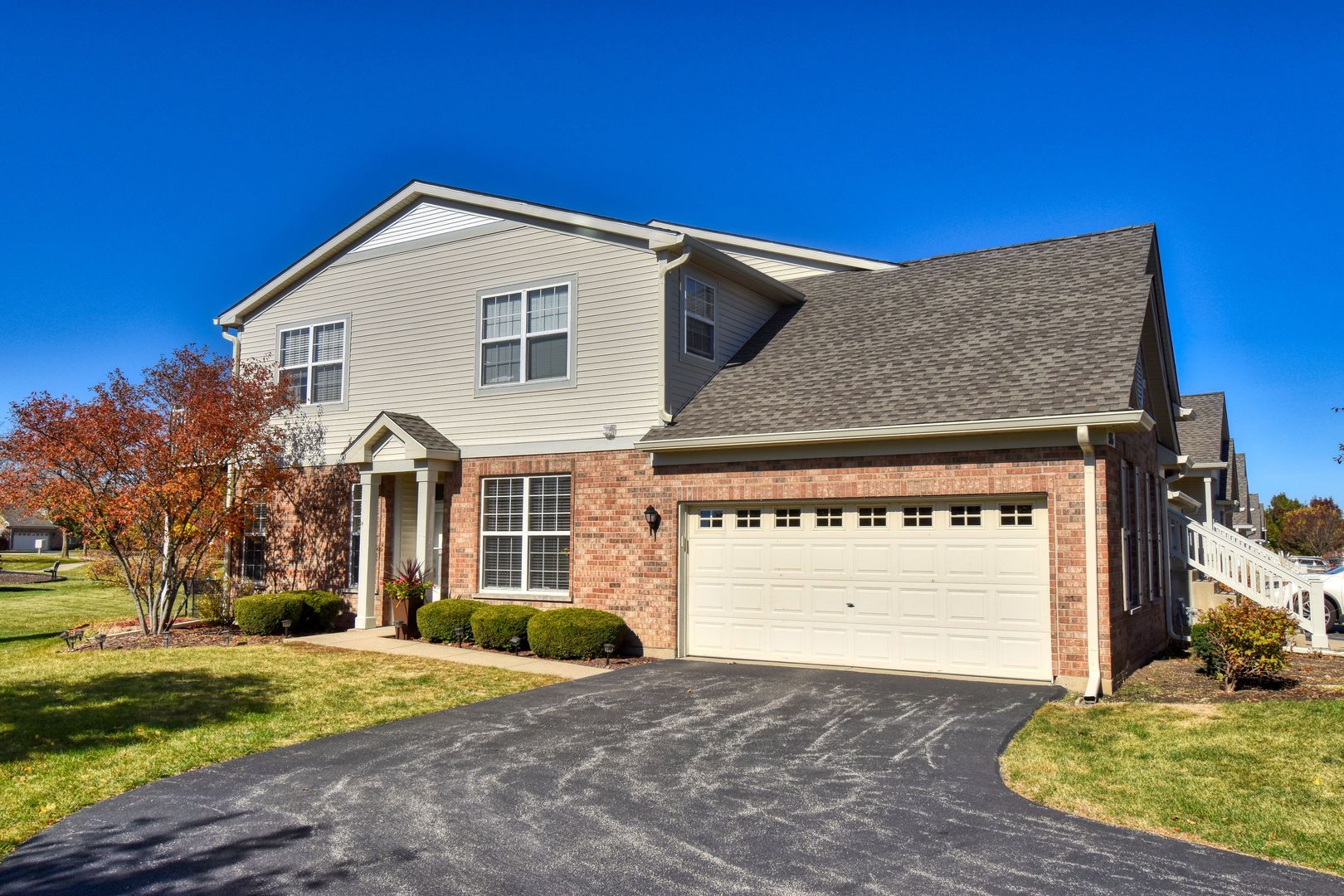 a front view of a house with a yard