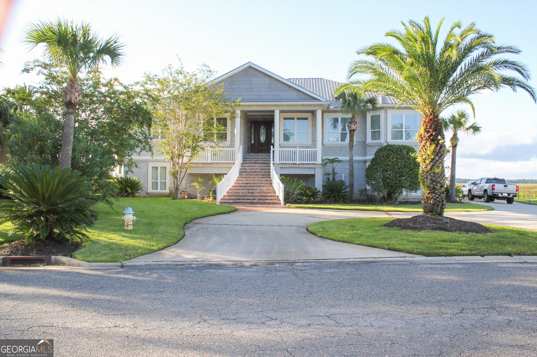 a front view of house with yard and green space