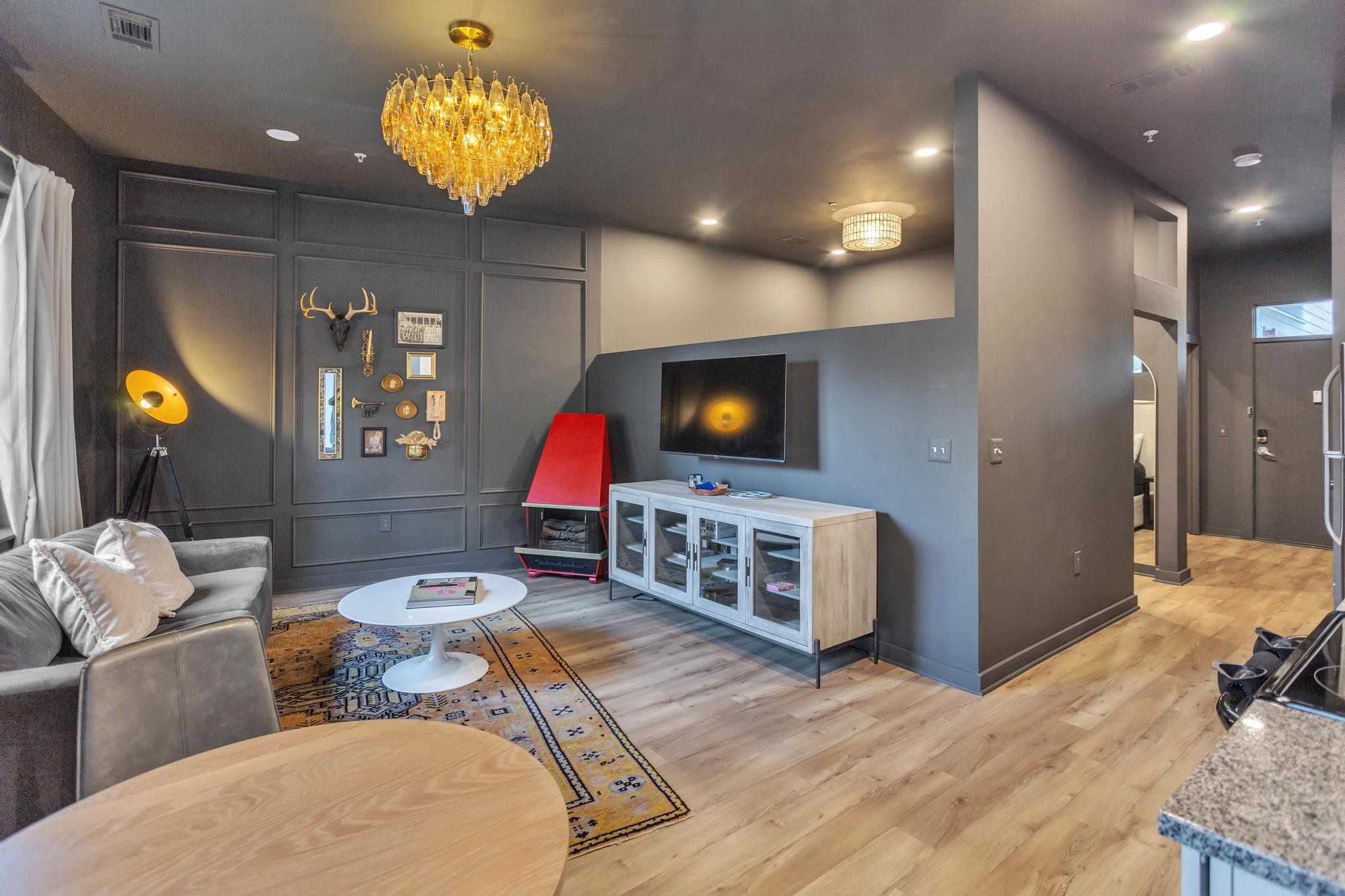 a living room with furniture and a flat screen tv