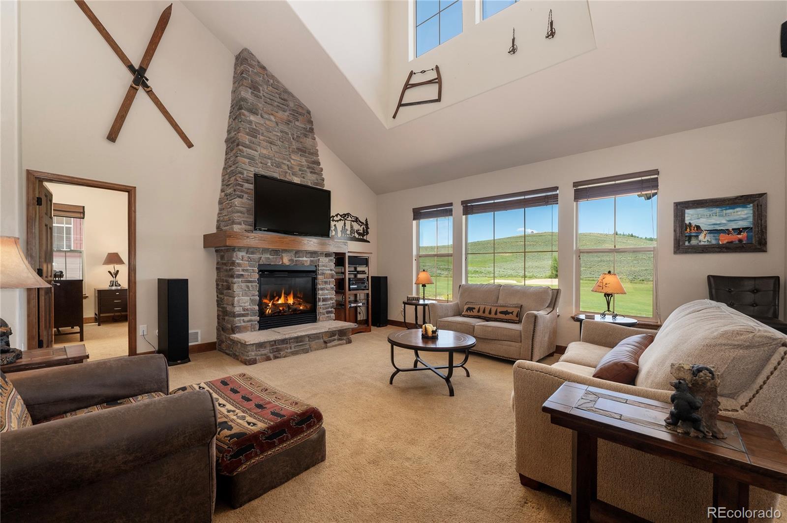 a living room with furniture fireplace and a flat screen tv