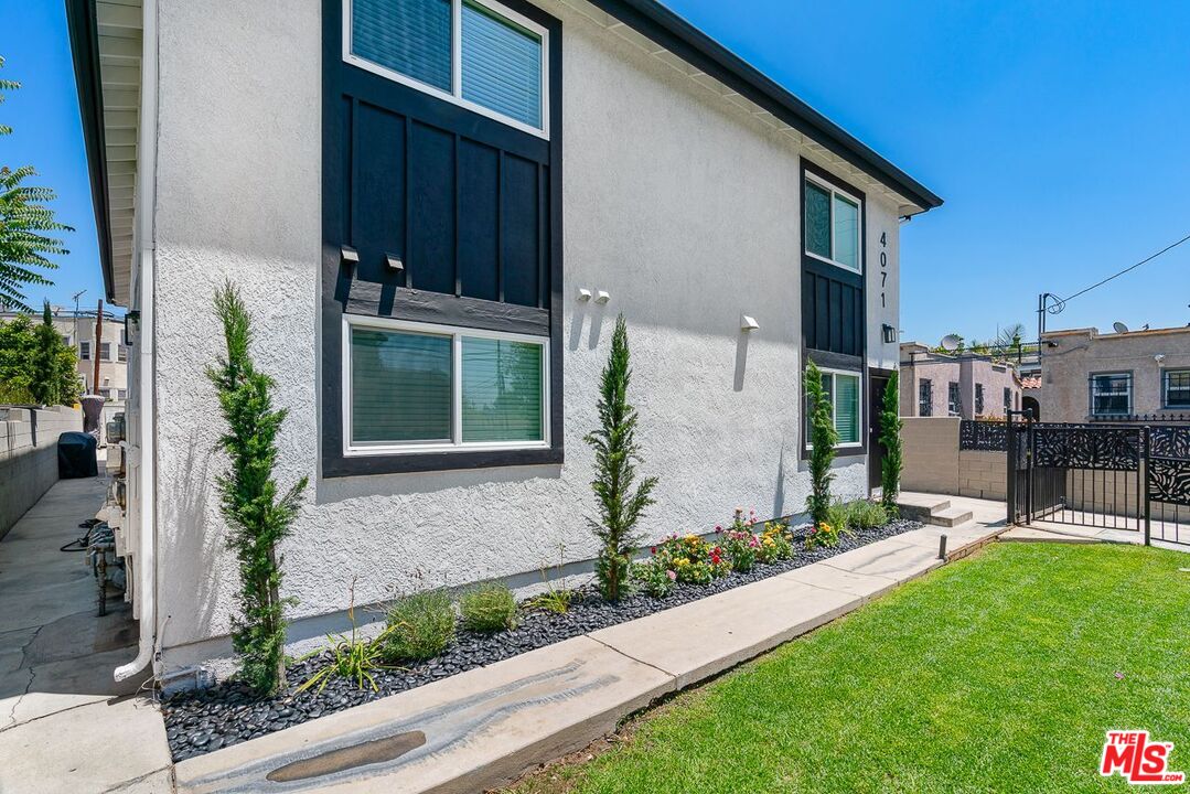 a house with garden in front of it