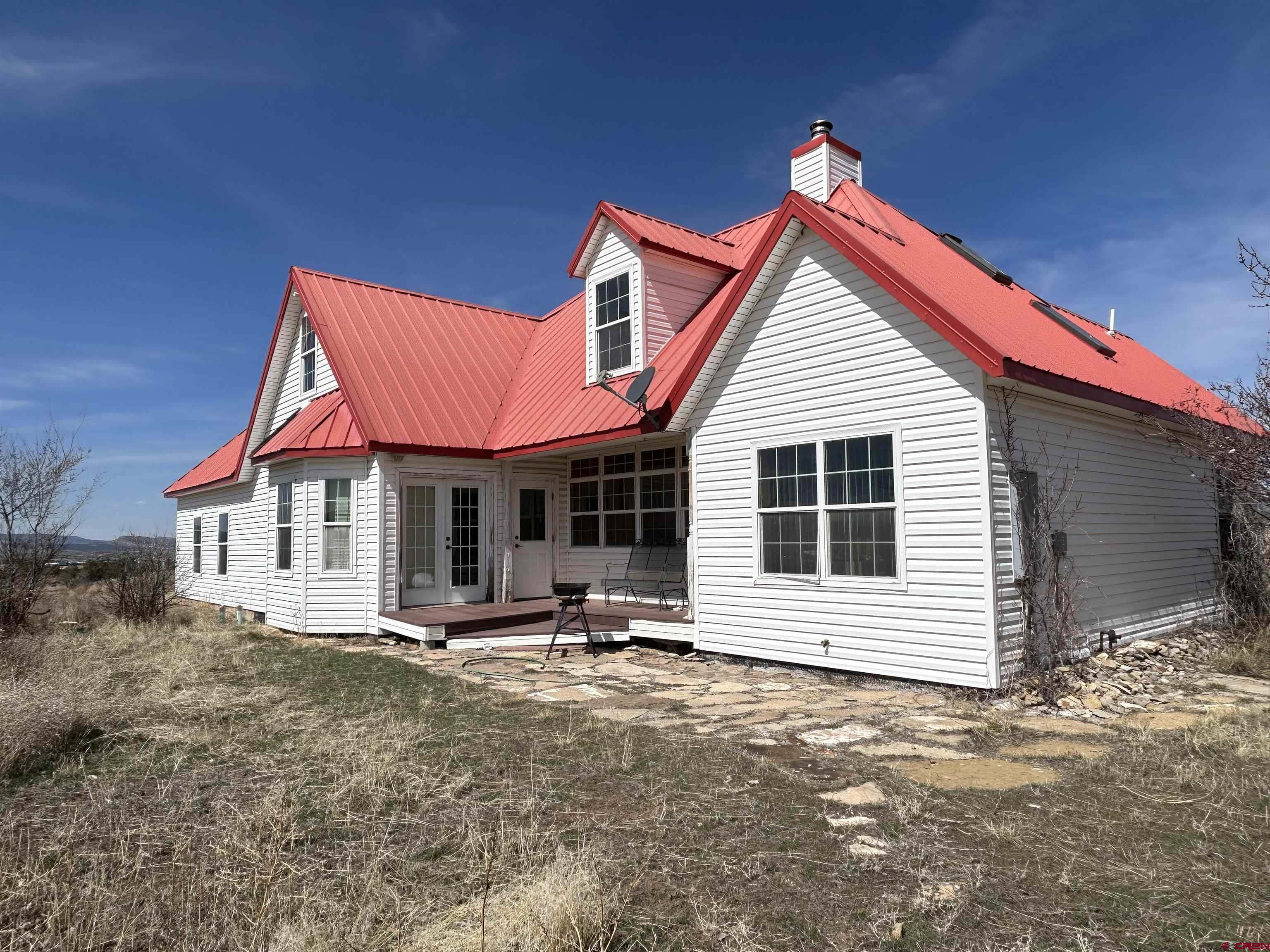 a view of a house with wooden walls