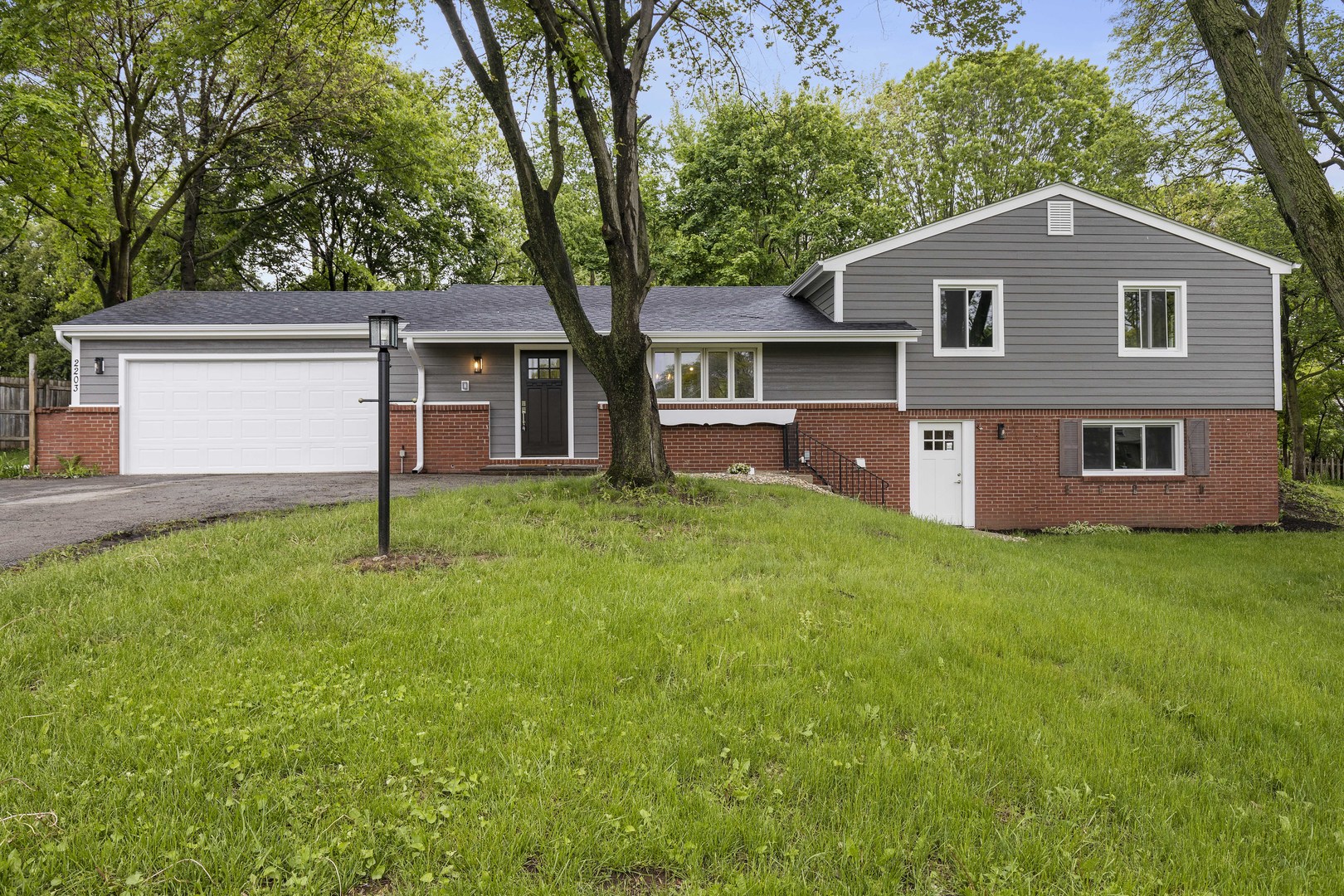 front view of a house with a yard