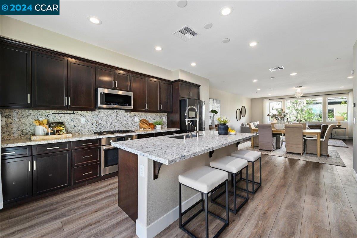 a large kitchen with lots of counter space a sink and appliances