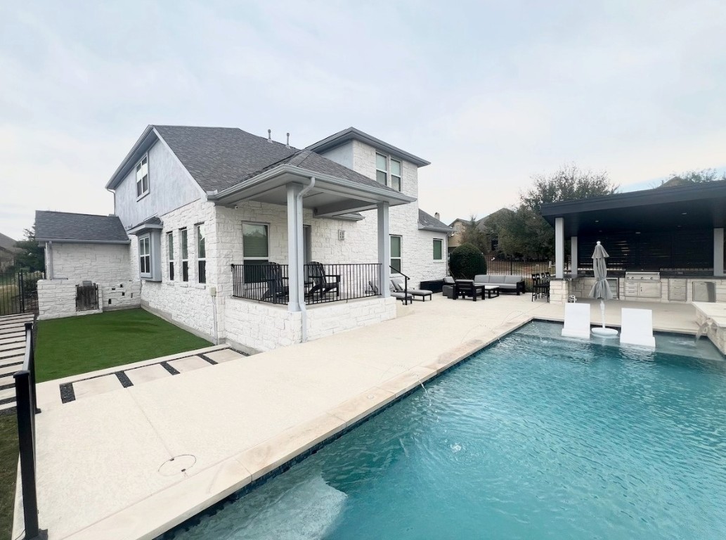 a view of house with yard and car parked