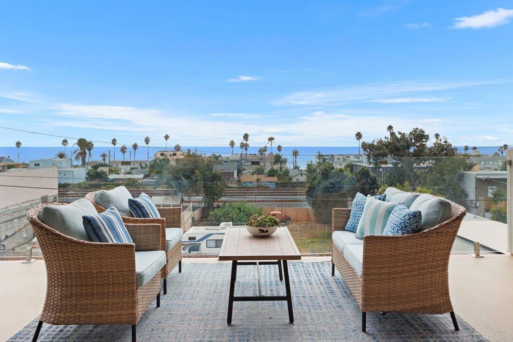 a patio with patio a couch and chairs