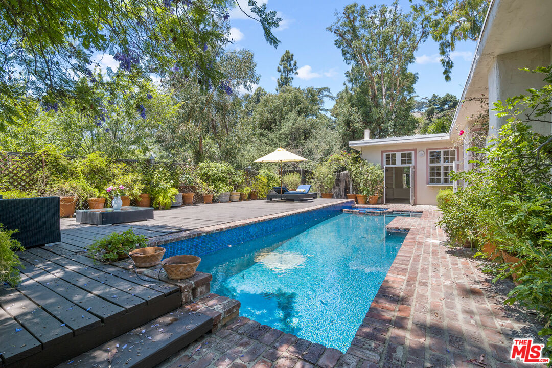 a view of a backyard with sitting area